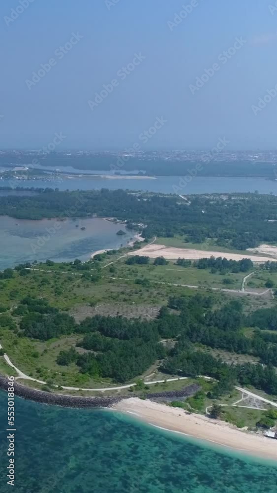 Aerial shot of bay, beaches and shallow reefs with the waves crashing on them Aerial shot of bay, beaches and shallow reefs with the waves crashing on them