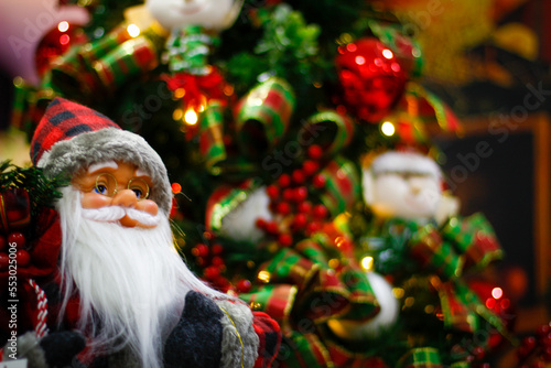 santa claus with christmas tree background