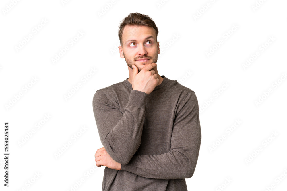 Young handsome caucasian man over isolated chroma key background thinking an idea while looking up Young handsome caucasian man over isolated chroma key background thinking an idea while looking up