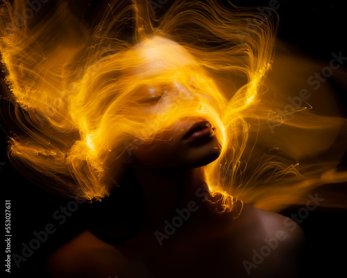 Abstract photography in the style of light painting. girl on a black background	