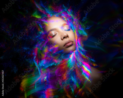 Abstract photography in the style of light painting. girl on a black background 