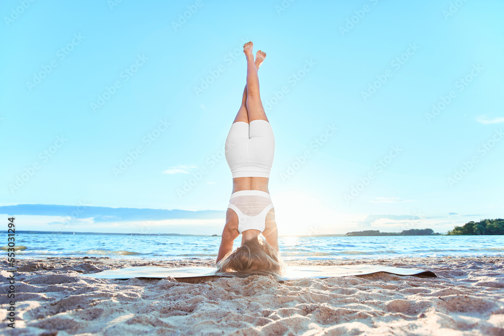 young woman performing yoga exercises. Headstand , inversion. young woman performing yoga exercises. Headstand , inversion.