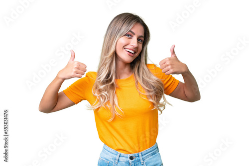 Young Uruguayan woman over isolated background giving a thumbs up gesture
