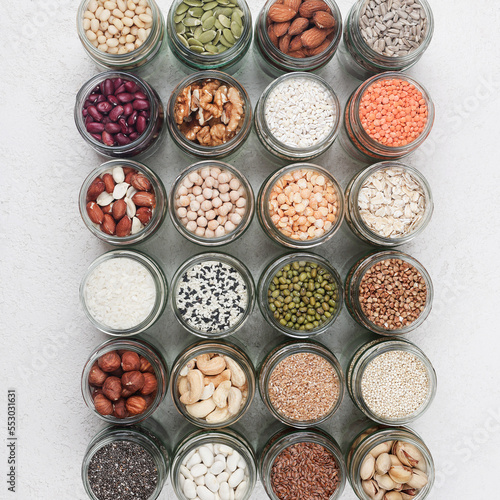 Vegan protein source. healthy vegetarian food. top view of seeds, nuts, peas, beans, rice, spelt, oatmeal on white background square