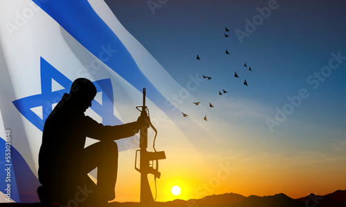Silhouette of soldier kneeling down on a background of sunset and Israel flag. Greetning card for National Holidyas. EPS10 vector