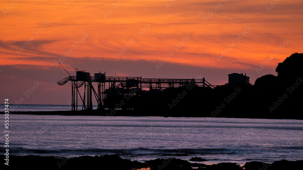 Close up on Carrelet from Diable Bridge of Royan, France, with cloudy sky sunset