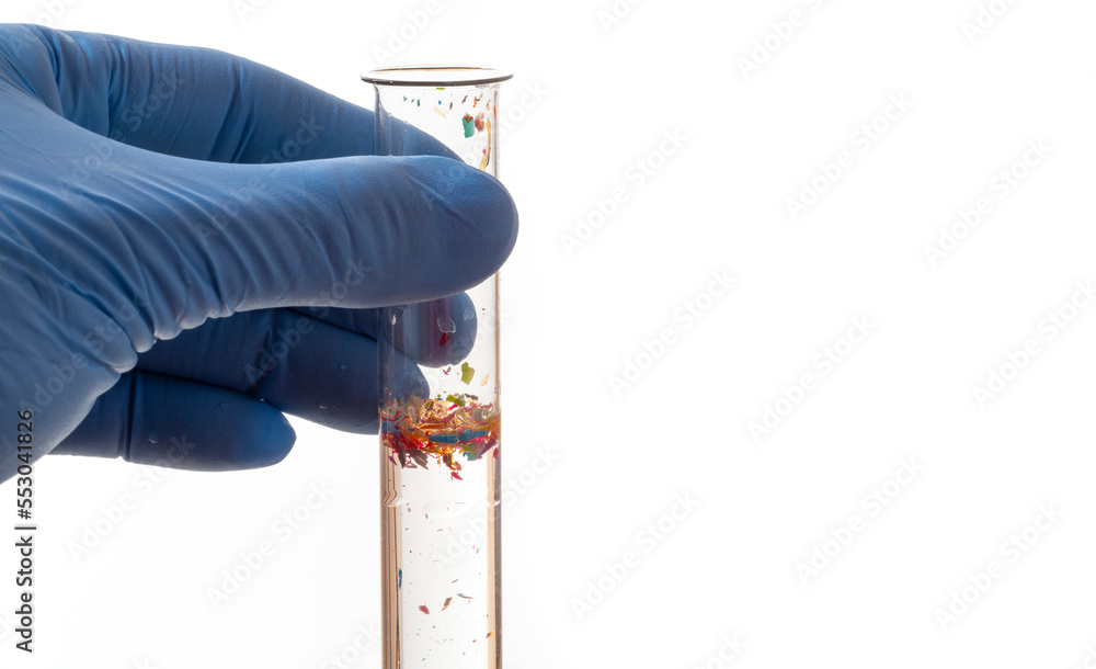 Microplastics in a test tube with water sample polluted water Stock