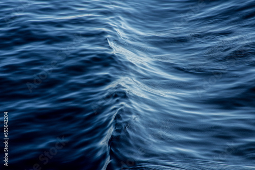 An image of the motion of blue ocean water.