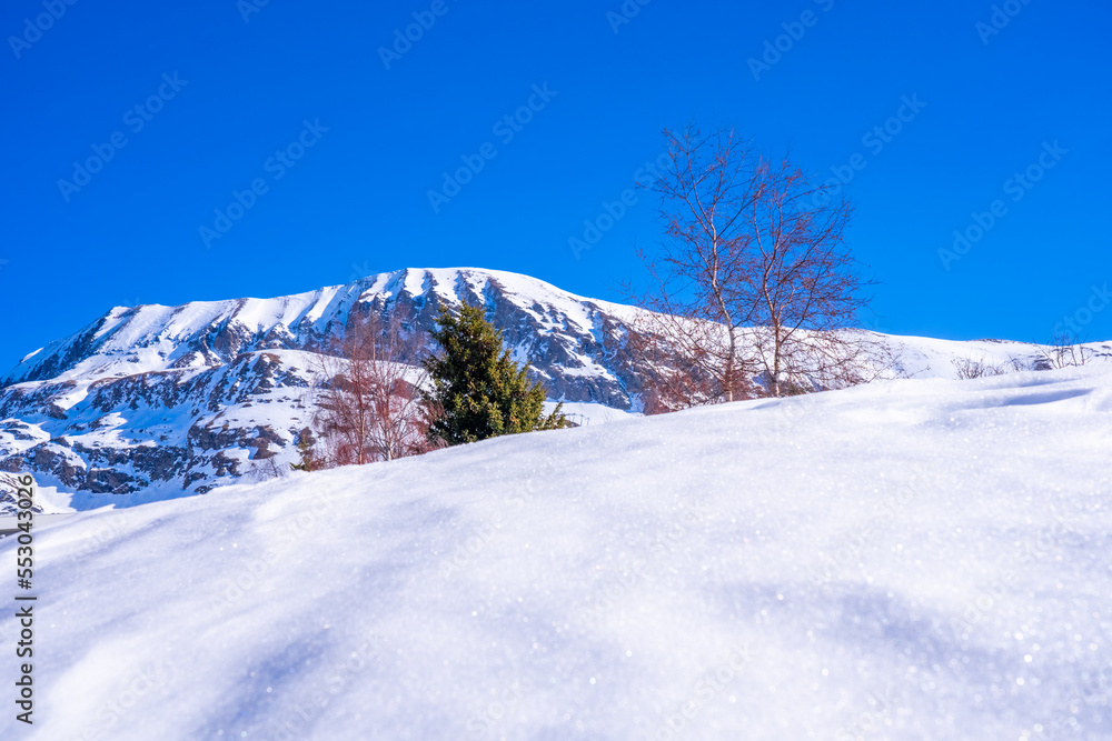 Snow mountain in winter. Concept of winter recreation in the mountains. Beautiful winter background.