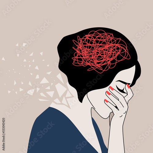 Depressed adult woman with confused thoughts holds the head with her hand. The concept of mental illness. Borderline personality disorder