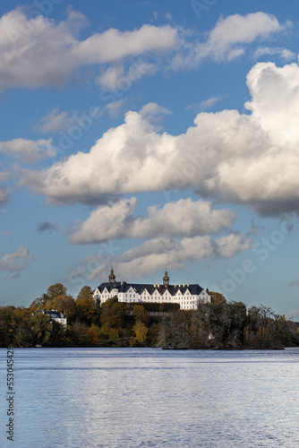 Plon, Plön, Ploen lake Großer Plöner See, dramatic clouds fly over the lake in background Ploen castle Plöner Schloss