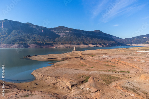 Sau reservoir without water because of the problems of extreme dryness and lack of rain. Soil desertification, lack of water, climate change, environmental problems. Pantà de Sau, Catalonia.