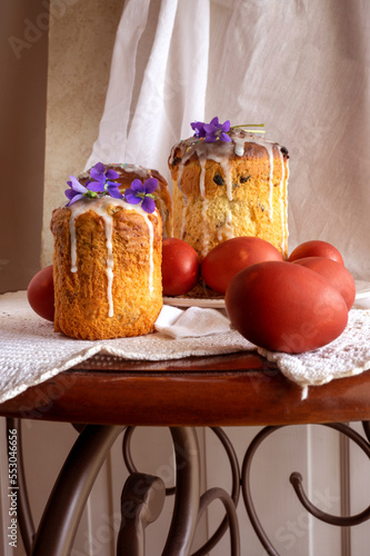 Delicious Easter cake or bread and painted eggs on table, Orthodox kulich, paska