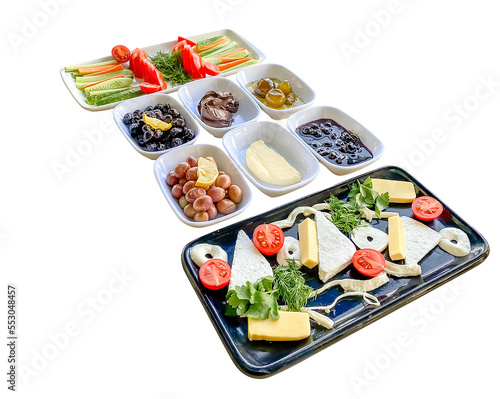 Breakfast top view, turkish style, jam, eggs, bread, olives, cheese, honey, tomatoes, cucumbers, isolated on white background, clipping path.