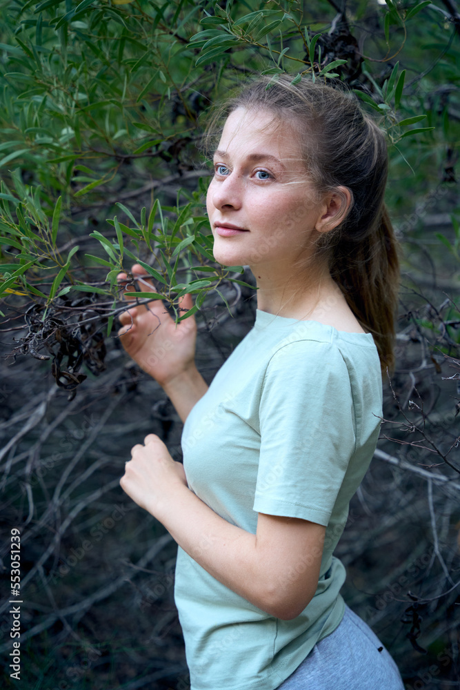 A smiling gorgeous lady in a forest A smiling gorgeous lady in a forest