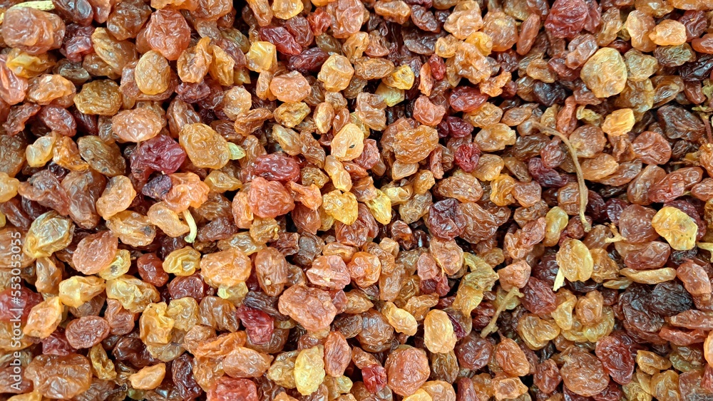 Light raisin. Located throughout the frame. Top view. Background. Texture. Copy space