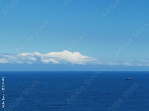 Beautiful ocean background with layer of cloud above the horizon