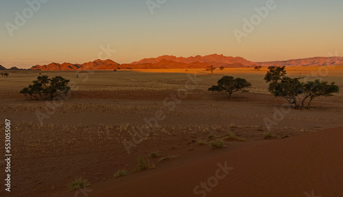 sunrise in the desert with colourful sand dunes in the namib desert in Namibia