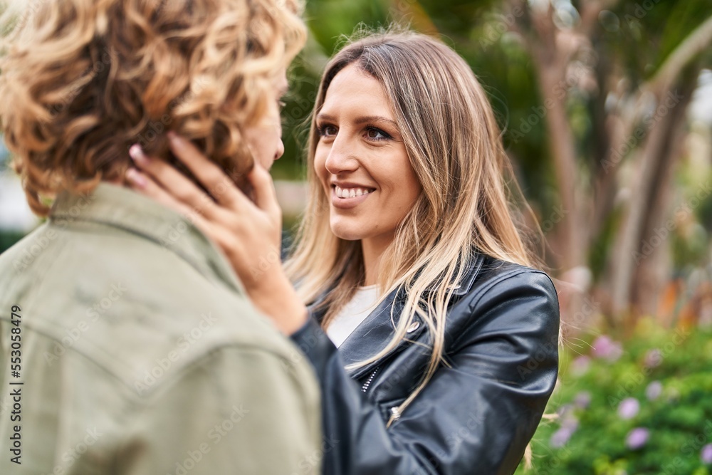 Man and woman couple smiling confident hugging each other at park Man and woman couple smiling confident hugging each other at park