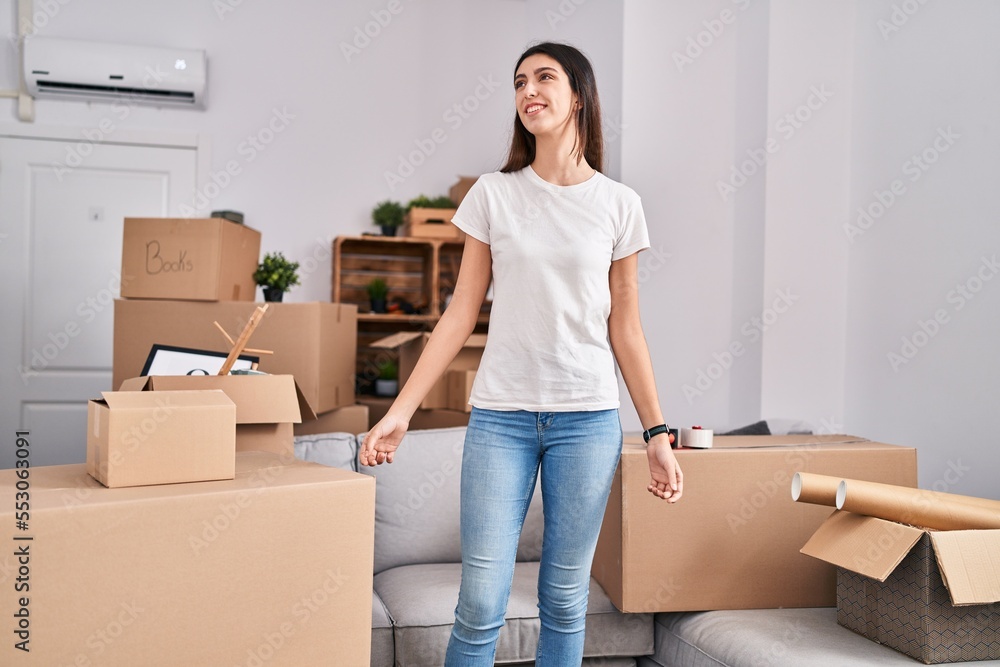 Young beautiful hispanic woman smiling confident standing at new home Young beautiful hispanic woman smiling confident standing at new home