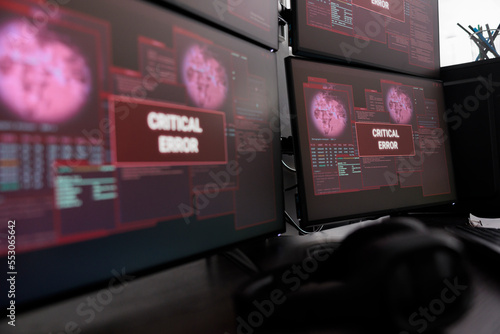 Fotografia Close up of multiple monitors having critical error message on display after cyber crime attack and hacking alert