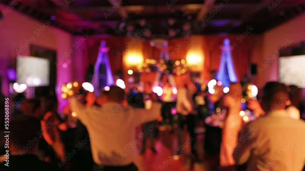 Blurry: People are dancing and partying at a New Year Eve's event Blurry: People are dancing and partying at a New Year Eve's event