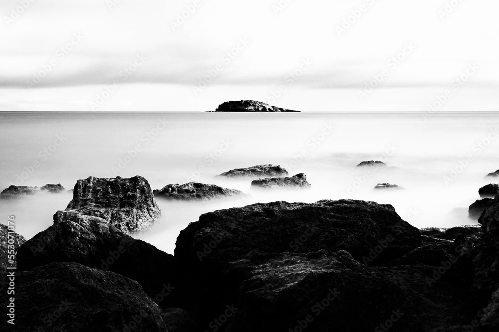 Rocks on the sea captured with a long exposure