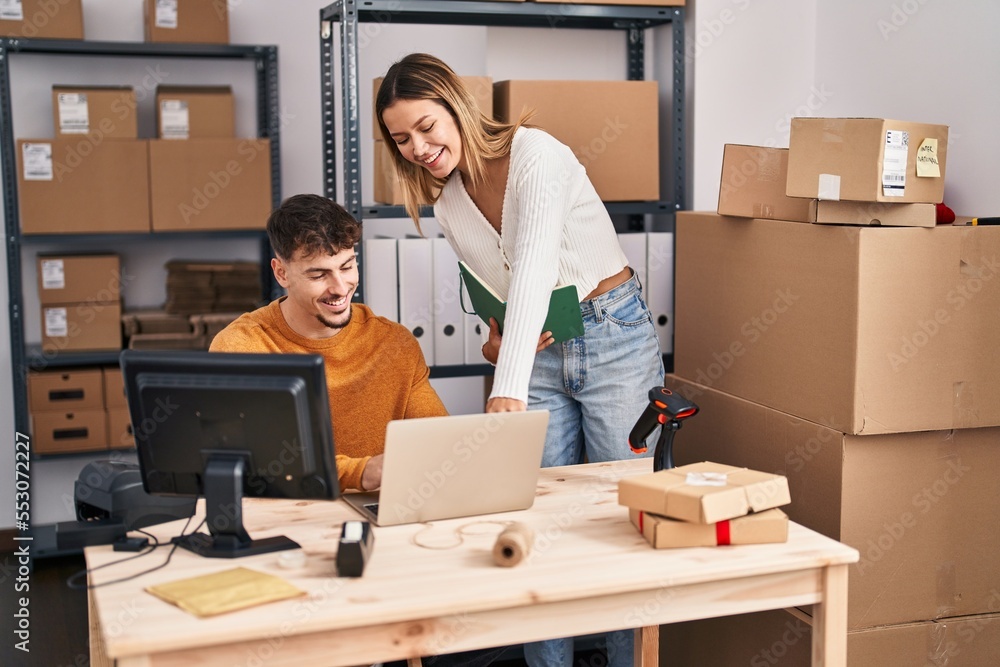 Young man and woman ecommerce business workers working at office Young man and woman ecommerce business workers working at office