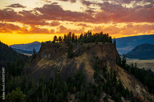 Sunset behind a hill from Calcite Springs viewpoint in Yellowstone National Park