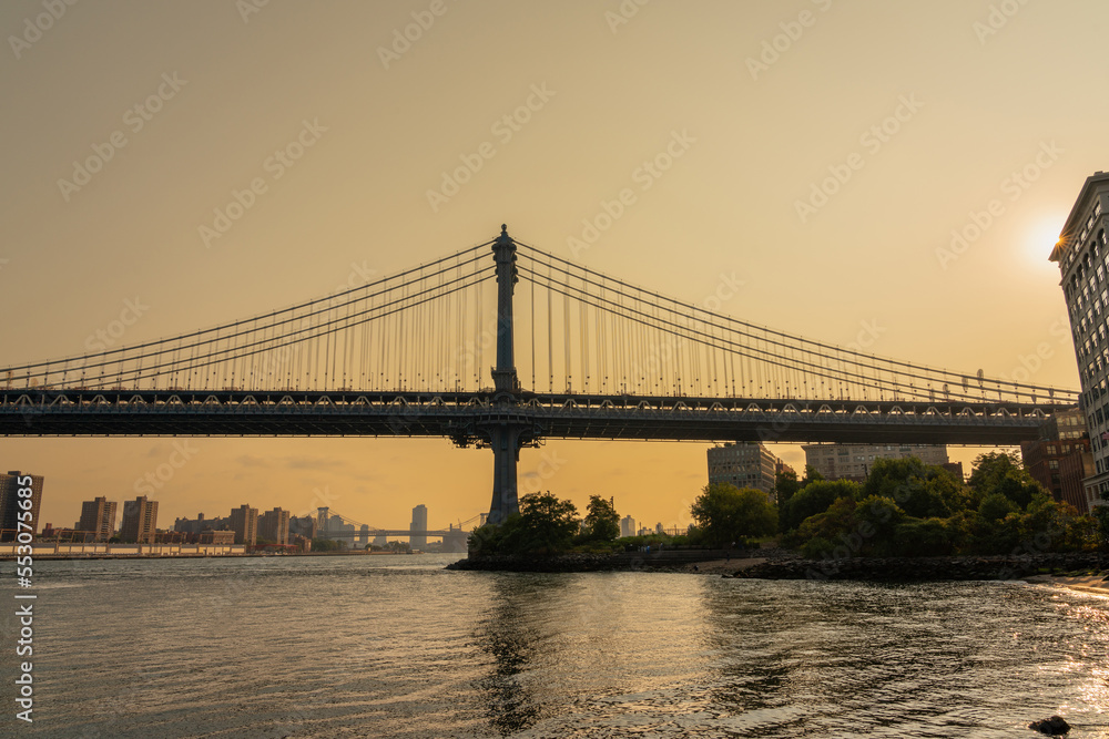 Manhattan bridge photo in profile in the tones of the rising sun