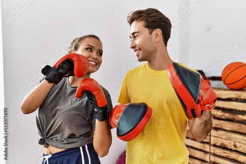 Man and woman couple smiling confident boxing at sport center