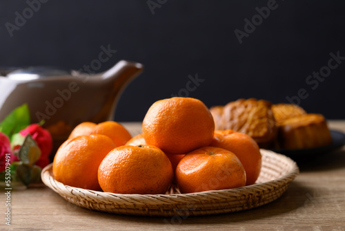 Mandarin orange fruit and Chinese moon cake celebrating in Chinese festival mid autumn or new year