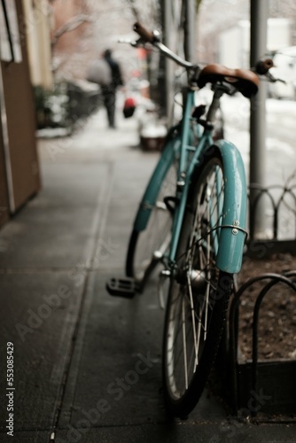 Retro vintage blue bike with leather sear in new york city manhattan
