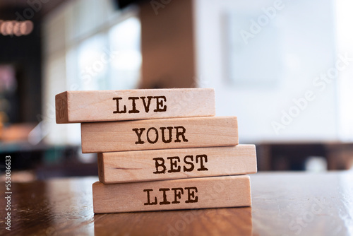 Photography Wooden blocks with words 'Live Your Best Life'.