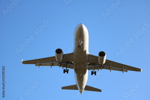 Airplane Landing Overhead at Major International Airport