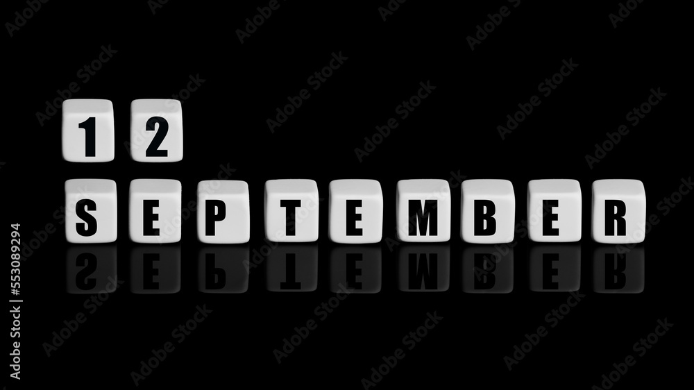 September 12th. Day 12 of month, Calendar date. White cubes with text on black background with reflection. Autumn month, day of year concept