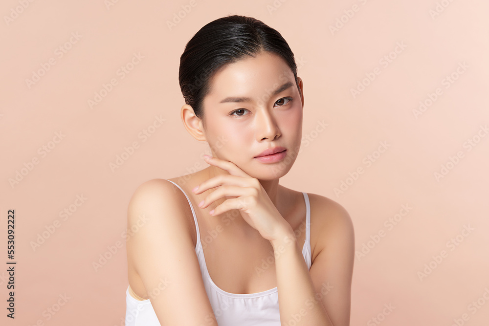 Beautiful young asian woman with clean fresh skin on beige background, Face care, Facial treatment, Cosmetology, beauty and spa, Asian women portrait. Beautiful young asian woman with clean fresh skin on beige background, Face care, Facial treatment, Cosmetology, beauty and spa, Asian women portrait.