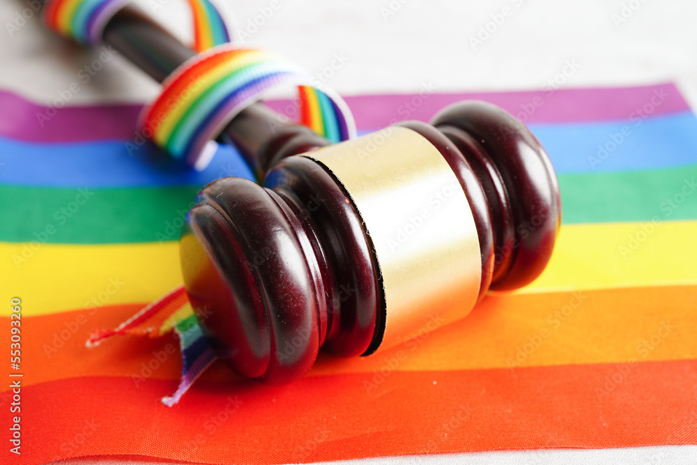Asian woman with rainbow flag, LGBT symbol rights and gender equality, LGBT Pride Month in June. Asian woman with rainbow flag, LGBT symbol rights and gender equality, LGBT Pride Month in June.