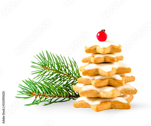 Gingerbread Christmas tree and green Christmas tree branches isolated on white background