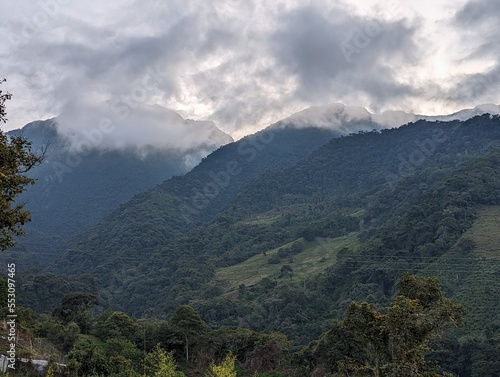 green mountains with clouds in the ecuadorian alps