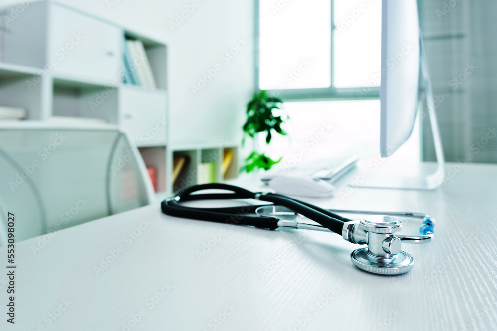 Doctor workplace with a stethoscope at table Doctor workplace with a stethoscope at table