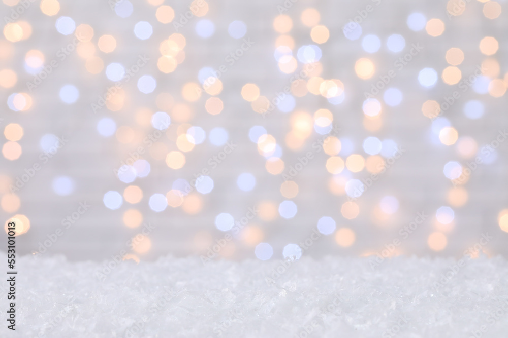 Snow against blurred Christmas lights Snow against blurred Christmas lights