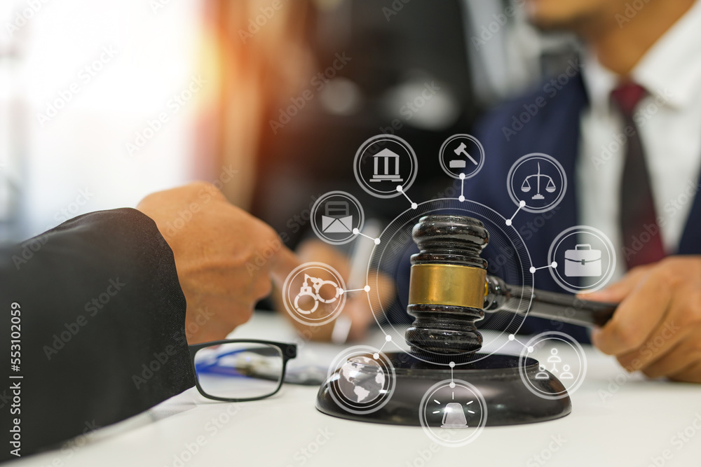 judge on wooden table And experienced lawyers meet with clients and give advice behind the scenes. legal services legal consulting concept judge on wooden table And experienced lawyers meet with clients and give advice behind the scenes. legal services legal consulting concept