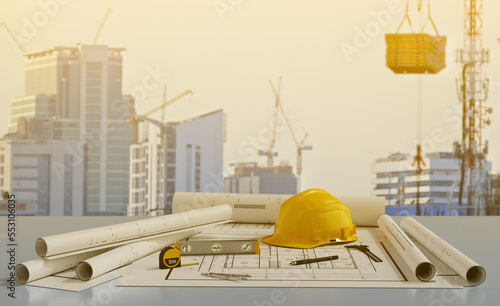 Blue prints with tool and  building under construction background.3D rendering photo