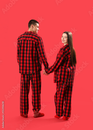 Young couple in matching re...