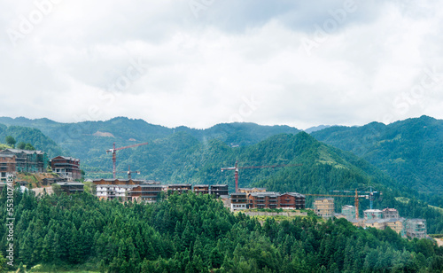 Construction site with crane on mountain range