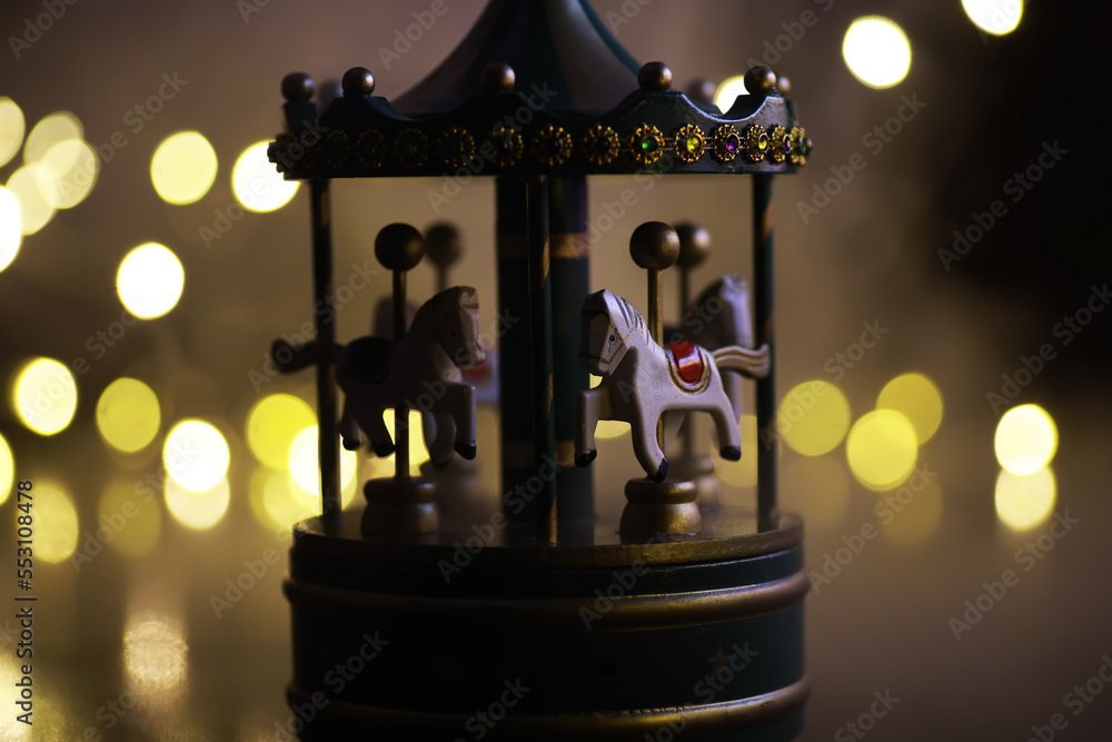 light carousel at night with horses in winter Carousel fun time Christmas night time