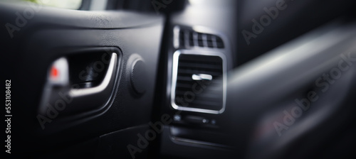The process of choosing climate control in the car. Various controls in auto switches. Modern car interior © alexkich