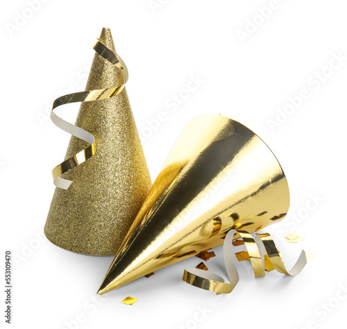 Golden party hats with confetti on white background
