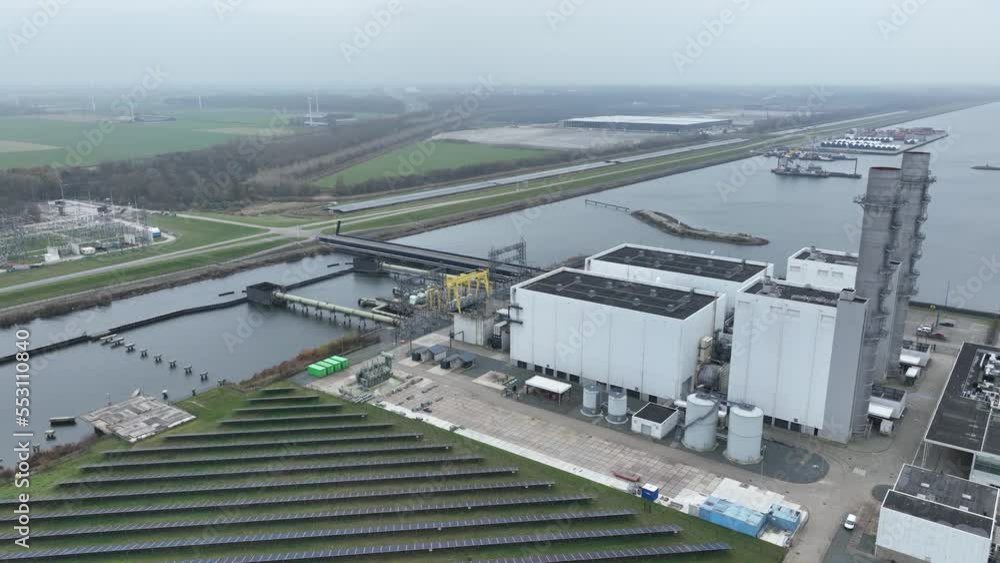 First gas-fired STEG Steam and gas powerd power electricity generation station GT26 technology. Artificially constructed island in IJsselmeer. Aerial First gas-fired STEG Steam and gas powerd power electricity generation station GT26 technology. Artificially constructed island in IJsselmeer. Aerial
